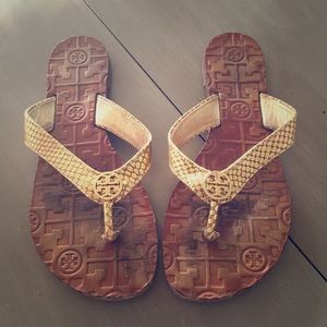 Tory Burch gold snakeskin flip flops